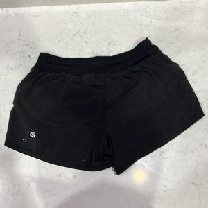 Black Lululemon running shorts with cut out detail